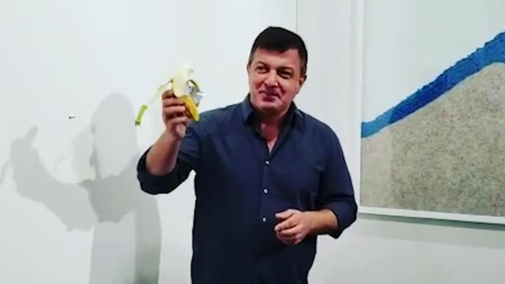 A banana taped to wall artist eats 120,000 piece of art Editorji